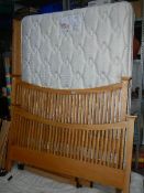 A solid oak bed frame with Myers mattress in good clean condition,