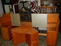 A 1960's light mahogany head board with side cabinets and a corner dressing table.