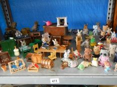 A mixed lot of doll house furniture and a quantity of small animals.