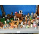 A mixed lot of doll house furniture and a quantity of small animals.