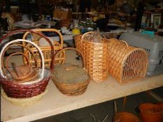 12 items of cane and wicker including 2 pet carriers.