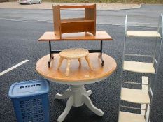 A round table, shelves, stool, linen bin etc.