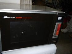 A large Sharp microwave oven.