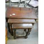 A nest of 3 oak tables.