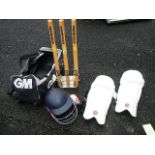 A good lot of cricket equipment including wickets, pads, helmet etc.