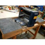 A Pro 1500w planer/thicknesser with table bench in working order.