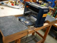 A Pro 1500w planer/thicknesser with table bench in working order.