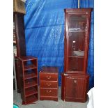 A mahogany effect corner cupboard and a 3 drawer chest.