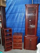 A mahogany effect corner cupboard and a 3 drawer chest.