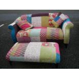 A good quality multi coloured fabric sofa with matching foot stool.