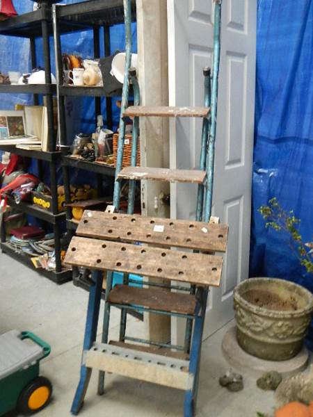 A folding work bench and a 5 tread step ladder.