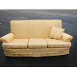 A brocade 3 seat sofa.