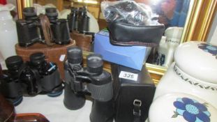 Four pairs of binoculars.