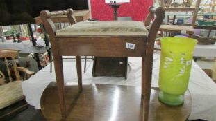 A Victorian piano stool.