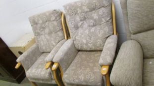 A pair of arm chairs.