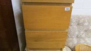 A two drawer bedroom chest.