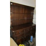 An oak three drawer dresser. 175 cm tall, 135 cm wide, 45 cm deep.