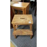 A pine step stool.