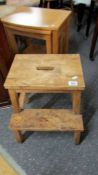 A pine step stool.