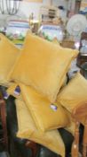 Ten new gold plush cushions.