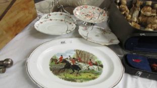 A hunting scene platter and four cake plates.