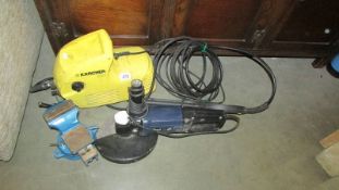 An 8" angle grinder, a Karcher pressure washer and a vice.