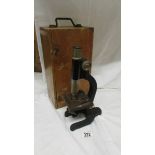 A vintage wood cased microscope.
