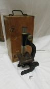 A vintage wood cased microscope.