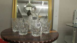 A cut glass decanter and six whisky tumblers.