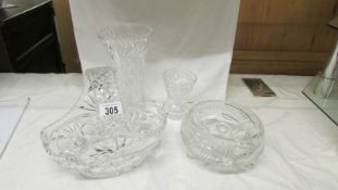 A cut glass basket, bowl and two vases.