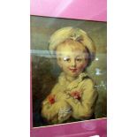 A framed and glazed portrait of a child.