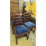 A set of six oak ladder back chairs.