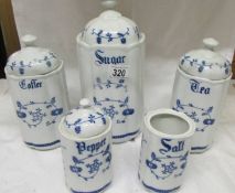 A set of blue and white storage jars, Sugar, tea, coffee, salt and pepper.