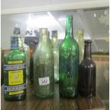 A mixed lot of old bottles including football related.