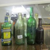 A mixed lot of old bottles including football related.