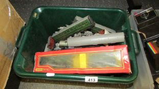 A box of model trains and tracks including Hornby.