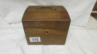 An Edwardian mahogany tea caddy.