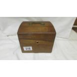 An Edwardian mahogany tea caddy.