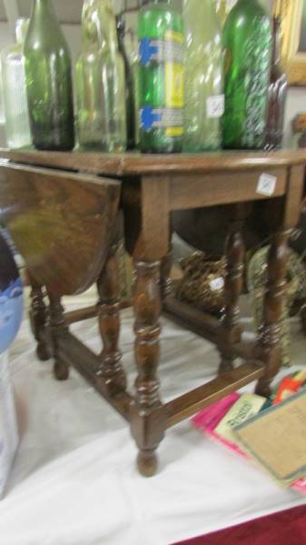 A good quality small oak drop side table.