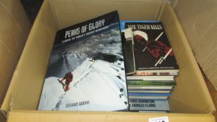 A box of mainly climbing related books.