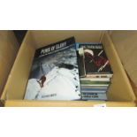 A box of mainly climbing related books.