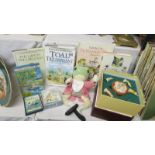 A quantity of Wind in the Willow books, a soft toy frog and a Beatrix Potter board game.