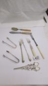 Four pickle forks, 2 sugar tongs, grape scissors etc.