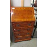 A small mahogany inlaid ladies bureau.