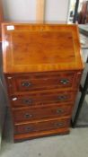 A small mahogany inlaid ladies bureau.