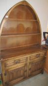 A nice small arched top oak dresser, 174 cm tall x 112 cm wide x 43 cm deep.