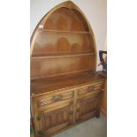 A nice small arched top oak dresser, 174 cm tall x 112 cm wide x 43 cm deep.