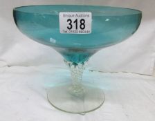 A blue glass footed bowl.