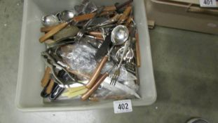 A box of assorted cutlery.