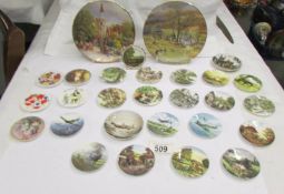 Twenty four miniature collector's plate and two larger examples.
